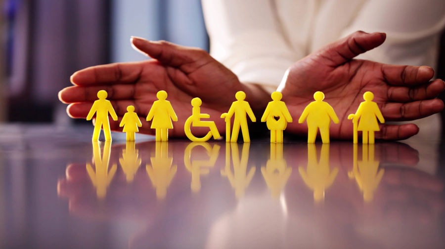 Visualisation of hands cradling universal symbols for men, women, children, disabled, elderly, pregnant.