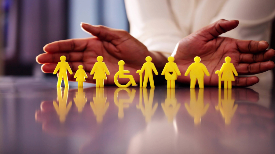 Visualisation of hands cradling universal symbols for men, women, children, disabled, elderly, pregnant.
