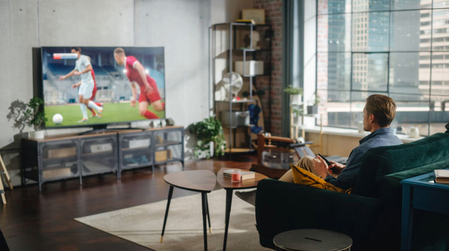 Man Watching Football On TV